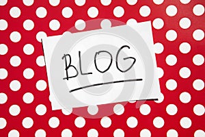 Blog - text on red with white dots background, internet blogging concept