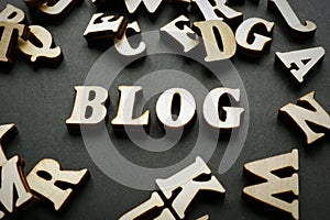 Blog and wooden letters on desk. Blogging concept