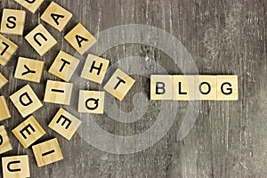 Blog word made of wooden blocks on a dark background