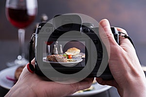 Blogger photographs food. Grilled beef steak