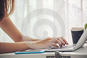 Blogger Woman hands typing laptop keyboard. Close up women hands using laptop social network person. Freelance girl work from home
