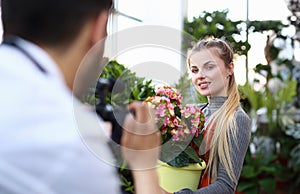 Blogger Woman Recording Pink Flower on Camera