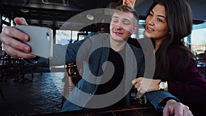 Bloggers take selfie using smartphone in new luncheonette