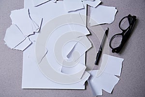 Blogging, blog and blogger or social media concept: scraps of paper and a pack of paper and glasses. Flat lay