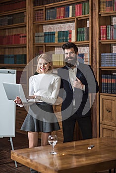 Blogging concept. Happy woman and man blogging in library. Business man and woman enjoy video blogging and online