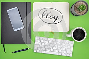 Blogging concept, top view of word BLOG on note pad