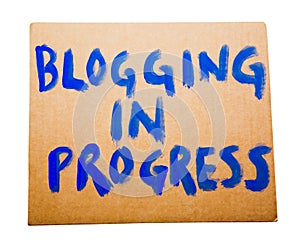 Blogging in progress on placard photo
