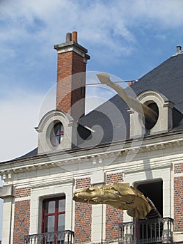 Blois, France - 07/2014: House of Magician Robert-Houdin with figures of dragons with spectacles, museum and interactive site on