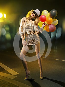 Blond alluring woman with balloons
