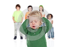 Blond baby worried with his brothers of background