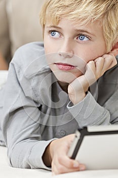 Blond Blue Eyes Boy Child Using Tablet Computer