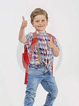 Blond boy greets with thumb up