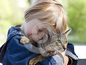 Blond boy with oriental bred cat
