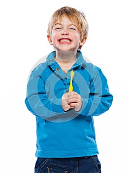 Blond boy with a toothbrush
