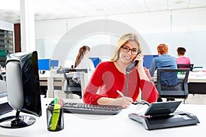 Blond businesswoman in call center working office