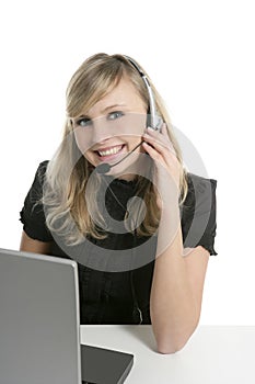 Blond businesswoman with laptop and microphone