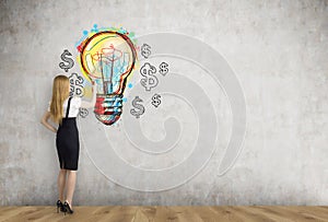 Blond businesswoman and light bulb with dollars