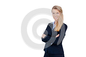 Blond businesswoman standing with crossed arms