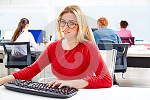 Blond businesswoman working office with computer