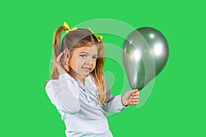 A blond child holding a ultimate gray balloon, with her hand to ear listening to your advertisement