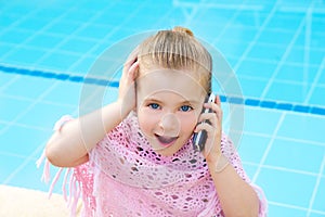 Blond child little girl talking mobile phone