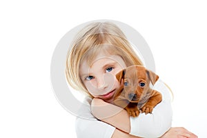 Blond children girl with dog puppy mini pinscher