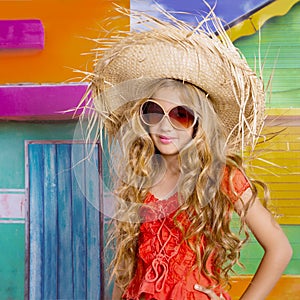 Blond children happy tourist girl beach hat and sunglasses