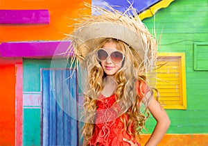 Blond children happy tourist girl beach hat and sunglasses