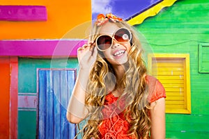 Blond children happy tourist girl smiling with sunglasses