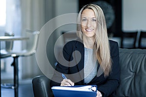 Blond Confident Businesswoman Working At Home