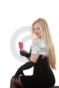 Blond in a dress drink wine