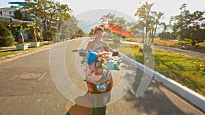 Blond European Girl Rides Motorcycle along Street