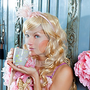 Blond fashion princess woman drinking tea