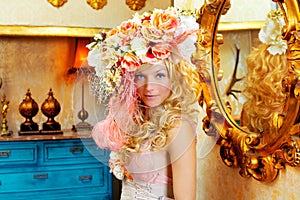 Blond fashion woman with spring flowers hat