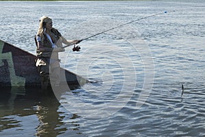 Blond fishing woman