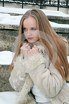 Blond freckled girl in fur coat photo