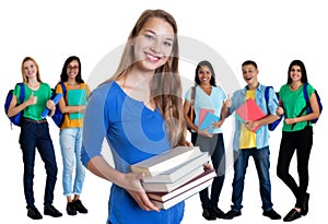 Blond german female student with books and group of students