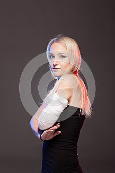 Blond girl with a broken arm