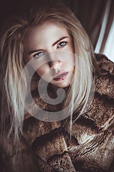 Blond girl with a cold stare