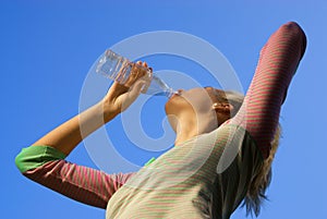 Blond girl dinking water
