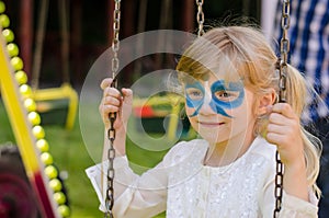Blond girl with facepainting