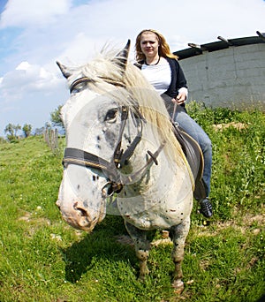 Blond girl on horse