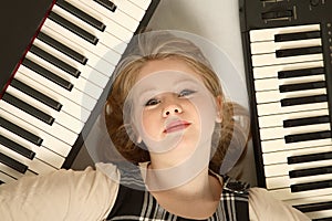 Blond girl and keyboards