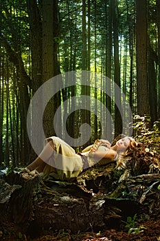 Blond girl in a magic forest