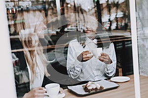 Blond Girl. Mulatto. Sit. Cafe. Drink Coffee.