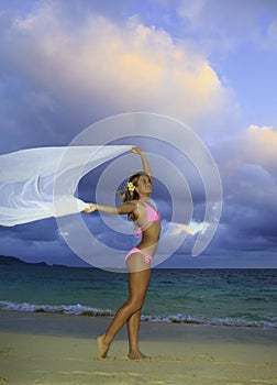 Blond girl in pink bikini and chiffon