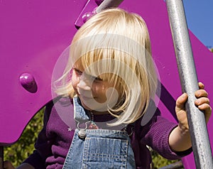 Blond girl at the playground