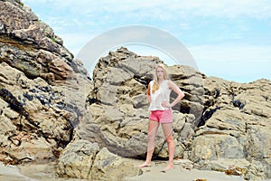 Blond girl posing on the beach in Spain
