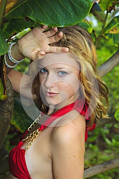 Blond girl in red bikini in Hawaii