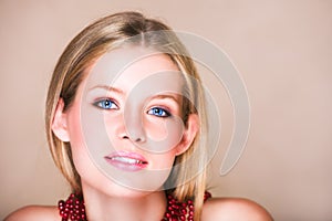 Blond girl in red necklace